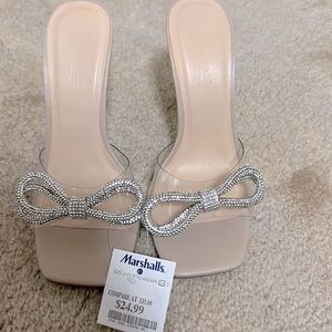 NWT Anne Michelle clear/nude sandal with rhinestone bow embellishment.